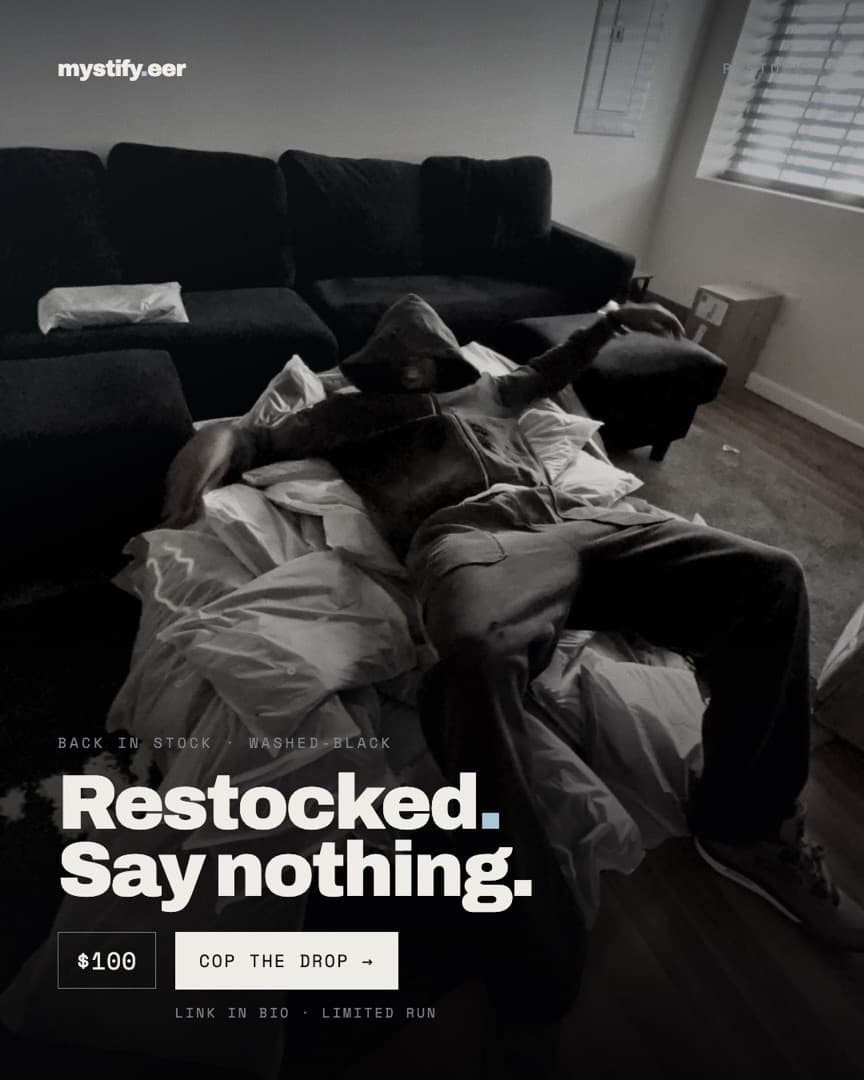 Model reclining across a sofa in washed-black, headline Restocked. Say nothing.