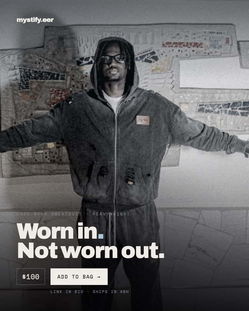 Model in the fade-wash heavyweight sweatsuit, arms outstretched, headline Worn in. Not worn out.